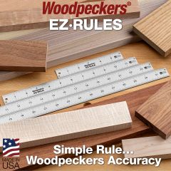 All four Easy Rules resting on a workbench alongside perfectly-milled maple, walnut, and rainbow poplar boards ready to be worked.